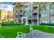 Well-maintained building exterior with manicured landscaping and stone accents at 5350 E Deer Valley Dr # 4239, Phoenix, AZ 85054