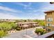 Scenic view of townhomes with tile roofs and desert landscaping, offering a tranquil residential environment at 5350 E Deer Valley Dr # 4239, Phoenix, AZ 85054