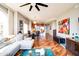 Spacious living room with hardwood floors, sofa, view of dining room, and stylish decor at 5350 E Deer Valley Dr # 4239, Phoenix, AZ 85054