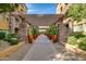 Inviting walkway lined with potted plants and stone pillars, creating a picturesque entrance to the property at 5350 E Deer Valley Dr # 4239, Phoenix, AZ 85054
