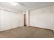 Bedroom featuring carpet, closet, and access to another room at 5421 W Seldon Ln, Glendale, AZ 85302