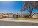 Charming single-story home features a well-maintained front yard and attached two-car garage at 5421 W Seldon Ln, Glendale, AZ 85302