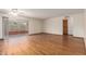 Bright living room features hardwood floors and a sliding glass door that leads to the backyard at 5421 W Seldon Ln, Glendale, AZ 85302