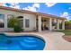 Enjoy outdoor living with a refreshing blue pool and covered patio for entertaining in this charming backyard at 5428 W Wethersfield Dr, Glendale, AZ 85304