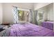 Bright bedroom with a large window, mirrored closet, and cozy decor at 5428 W Wethersfield Dr, Glendale, AZ 85304