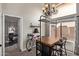Dining space with modern table, chandelier, and natural light at 5428 W Wethersfield Dr, Glendale, AZ 85304
