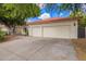 Lovely home featuring an attached two car garage, mature landscaping, and classic desert charm at 5428 W Wethersfield Dr, Glendale, AZ 85304
