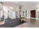 Spacious home gym with hardwood floors, plenty of natural light, and state-of-the-art fitness equipment at 5428 W Wethersfield Dr, Glendale, AZ 85304