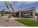 Spacious backyard with a pool, patio, and beautifully landscaped areas, great for relaxation at 5900 W Orchid Ln, Chandler, AZ 85226