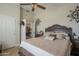 Bedroom featuring a vaulted ceiling, neutral paint, and coordinated furniture and decor at 5900 W Orchid Ln, Chandler, AZ 85226