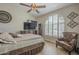 Bedroom showcasing vaulted ceilings, arched window with shutters, and a stylish ceiling fan at 5900 W Orchid Ln, Chandler, AZ 85226