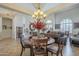 Elegant dining room with ample lighting and decorative floral arrangement at 5900 W Orchid Ln, Chandler, AZ 85226