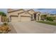 Beautiful single-story home showcasing a spacious driveway and low-maintenance landscaping at 5900 W Orchid Ln, Chandler, AZ 85226