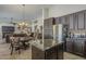 Kitchen features stainless appliances, granite countertops, island, and eat-in dining area at 5900 W Orchid Ln, Chandler, AZ 85226