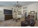 Bright and airy living room with a ceiling fan, tile floors, and stylish decor at 5900 W Orchid Ln, Chandler, AZ 85226