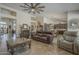 Spacious living room featuring a ceiling fan, tile flooring, and neutral tones at 5900 W Orchid Ln, Chandler, AZ 85226
