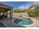 Relaxing pool area with a lounge chair, palm trees, and views of the covered patio at 5900 W Orchid Ln, Chandler, AZ 85226