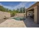 Gorgeous backyard pool with desert landscape and a covered patio area that is perfect for entertaining and relaxation at 5900 W Orchid Ln, Chandler, AZ 85226