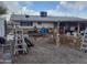 Exterior view of the home's messy backyard at 610 E Estevan Ave, Apache Junction, AZ 85119