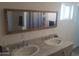 Modern bathroom featuring double sinks with granite countertops at 610 E Estevan Ave, Apache Junction, AZ 85119