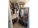 Well-organized walk-in closet with ample hanging space for clothing at 610 E Estevan Ave, Apache Junction, AZ 85119