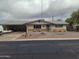 Charming single-story home with a low-maintenance rock front yard at 610 E Estevan Ave, Apache Junction, AZ 85119