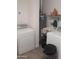 Functional laundry room with appliances, sink, and storage space for laundry essentials at 610 E Estevan Ave, Apache Junction, AZ 85119
