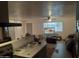 An open floor plan connects the kitchen to the spacious living room at 610 E Estevan Ave, Apache Junction, AZ 85119