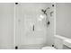 Modern bathroom showcasing frameless glass walk-in shower with white subway tile and black hardware at 672 S Porter St, Gilbert, AZ 85296