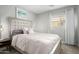 Calming bedroom with upholstered headboard, soft bedding, and decorative lamps on side tables at 672 S Porter St, Gilbert, AZ 85296