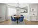 Inviting dining area featuring a modern light fixture and seating for four at 672 S Porter St, Gilbert, AZ 85296