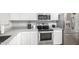 Stylish kitchen showcasing stainless steel appliances and granite countertops at 672 S Porter St, Gilbert, AZ 85296