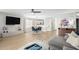 Open-concept living room featuring hardwood floors, modern decor, and lots of natural light at 672 S Porter St, Gilbert, AZ 85296