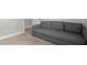 Inviting living room showcasing a gray couch and neutral carpet at 672 S Porter St, Gilbert, AZ 85296