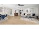 Open-concept living room featuring hardwood floors, modern decor, and lots of natural light at 672 S Porter St, Gilbert, AZ 85296