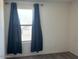 Bright bedroom with neutral carpet and curtains with ample natural light at 7227 N 125Th Dr, Glendale, AZ 85307