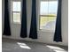 Inviting bedroom with plush carpet, natural light, and dark curtains at 7227 N 125Th Dr, Glendale, AZ 85307