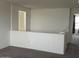 Open hallway area with neutral carpet, railing, and a view to another room at 7227 N 125Th Dr, Glendale, AZ 85307