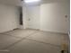 Garage features smooth concrete floors, and a door to interior at 7244 E Hackamore Ln, San Tan Valley, AZ 85143
