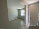 Bright living room with durable, light-toned tile flooring and a large window offering ample natural light at 7244 E Hackamore Ln, San Tan Valley, AZ 85143