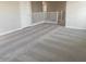 Spacious loft area featuring plush carpeting and ample natural light, ideal for a Gathering room or play area at 7244 E Hackamore Ln, San Tan Valley, AZ 85143