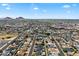 Scenic aerial view captures a charming town nestled among rolling hills, showcasing its well-planned streets, and green spaces at 7502 E Princeton Ave, Scottsdale, AZ 85257