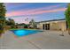 Charming backyard oasis with a sparkling pool, patio area, and well-maintained landscaping, ideal for relaxation and recreation at 7502 E Princeton Ave, Scottsdale, AZ 85257