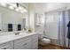 Bathroom featuring a white vanity, mirror, toilet, and bathtub at 7502 E Princeton Ave, Scottsdale, AZ 85257