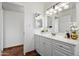 Bathroom showcasing a white vanity, sink, and mirror at 7502 E Princeton Ave, Scottsdale, AZ 85257