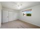 Spacious bedroom with plush carpeting, ample closet space, and natural light at 7502 E Princeton Ave, Scottsdale, AZ 85257
