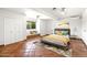 Inviting bedroom with warm tones, stylish decor, and window seat for reading at 7502 E Princeton Ave, Scottsdale, AZ 85257