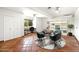 Versatile home office space with modern furniture, built-in shelving, and ample natural light at 7502 E Princeton Ave, Scottsdale, AZ 85257