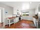 Sunlit kitchen with stainless steel appliances, tile floors and a charming butcher block island at 7502 E Princeton Ave, Scottsdale, AZ 85257