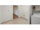 Functional laundry room featuring tiled floors, and convenient access to other rooms at 7502 E Princeton Ave, Scottsdale, AZ 85257
